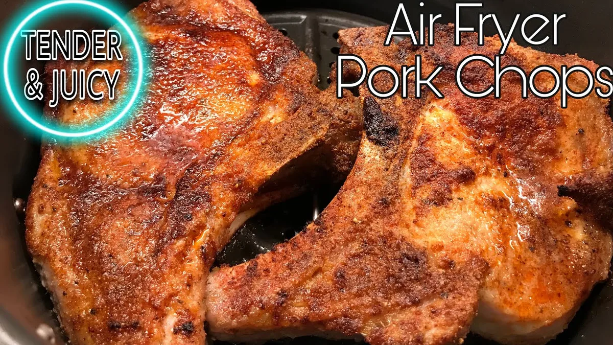 seasoned raw pork chops in air fryer basket